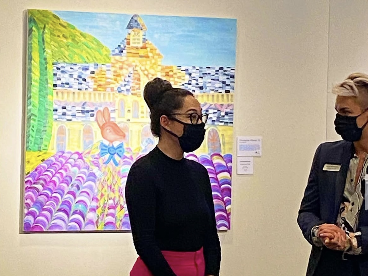 HARELQUIN & CHARLATAN is a vibrant oil painting on canvas, created by contemporary artist Christopher Alfonsso. The artwork depicts a curious and whimsical encounter between two figures set amidst the lavender fields of the Chateau l'Abbaye in the Provence region of France. This painting was exhibited at the Orlando Museum of Art (OMA) in 2020, highlighting its recognition in the contemporary art scene.